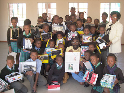 Presenting shoes at a school in So. Africa